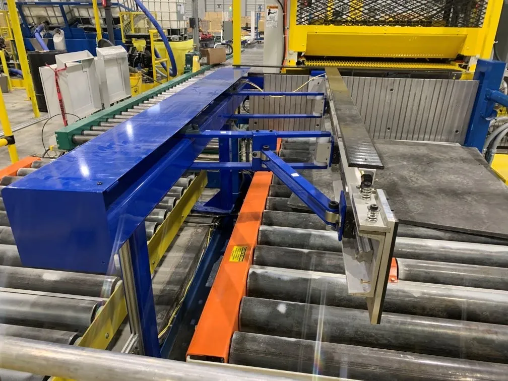 Close view of blue and orange conveyor and material-handling equipment