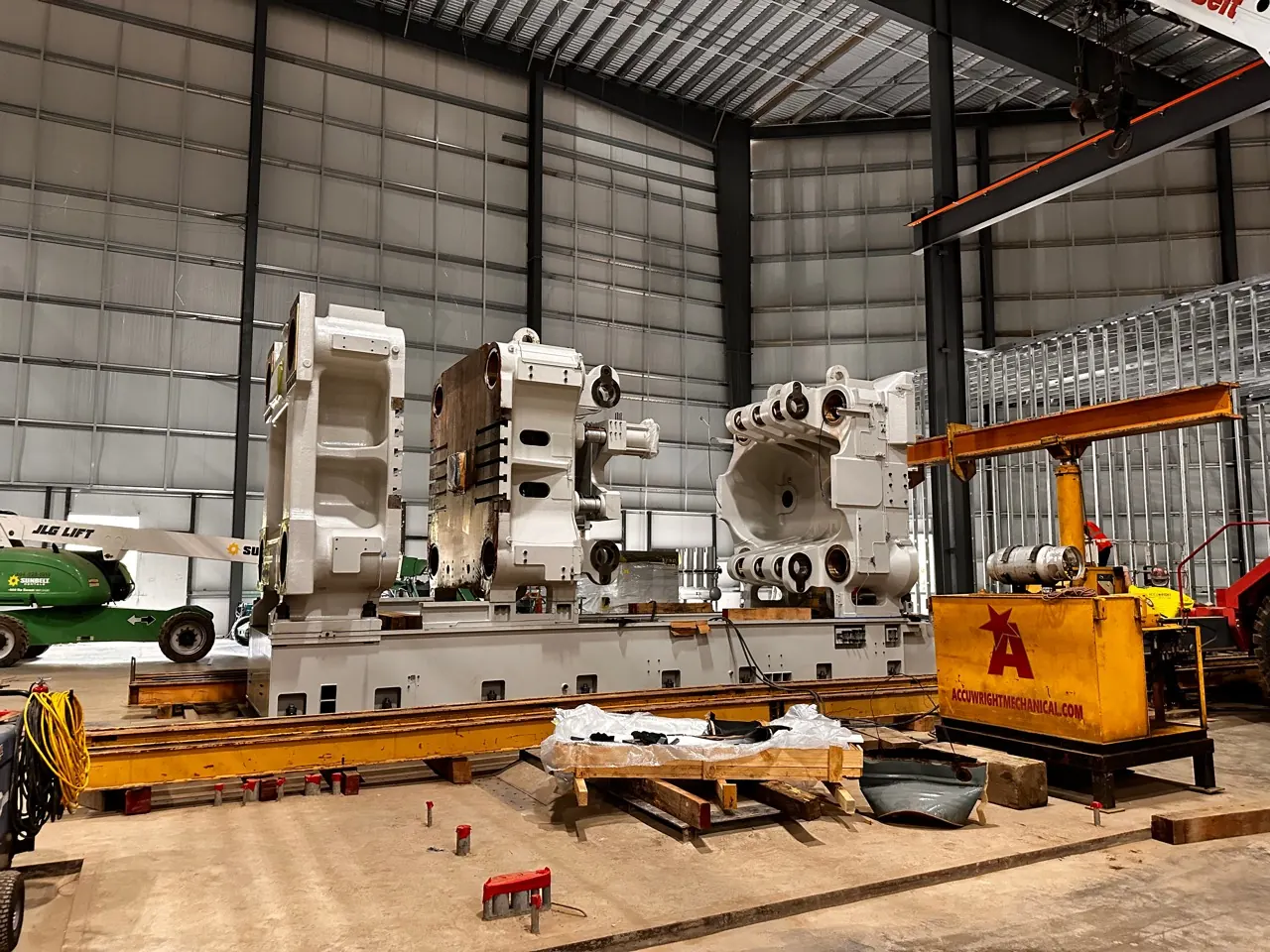 An Accuwright crew rigging a press during installation