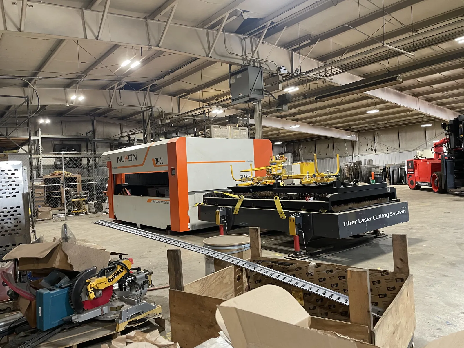 The Nukon REX fiber laser cutting system newly installed on the Accuwright fabrication shop floor