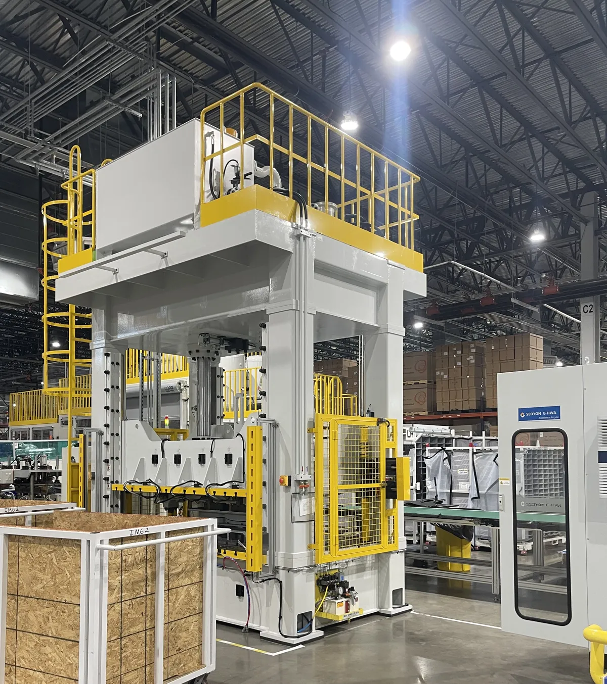 A large machine erected, leveled and standing on its anchors after millwright installation